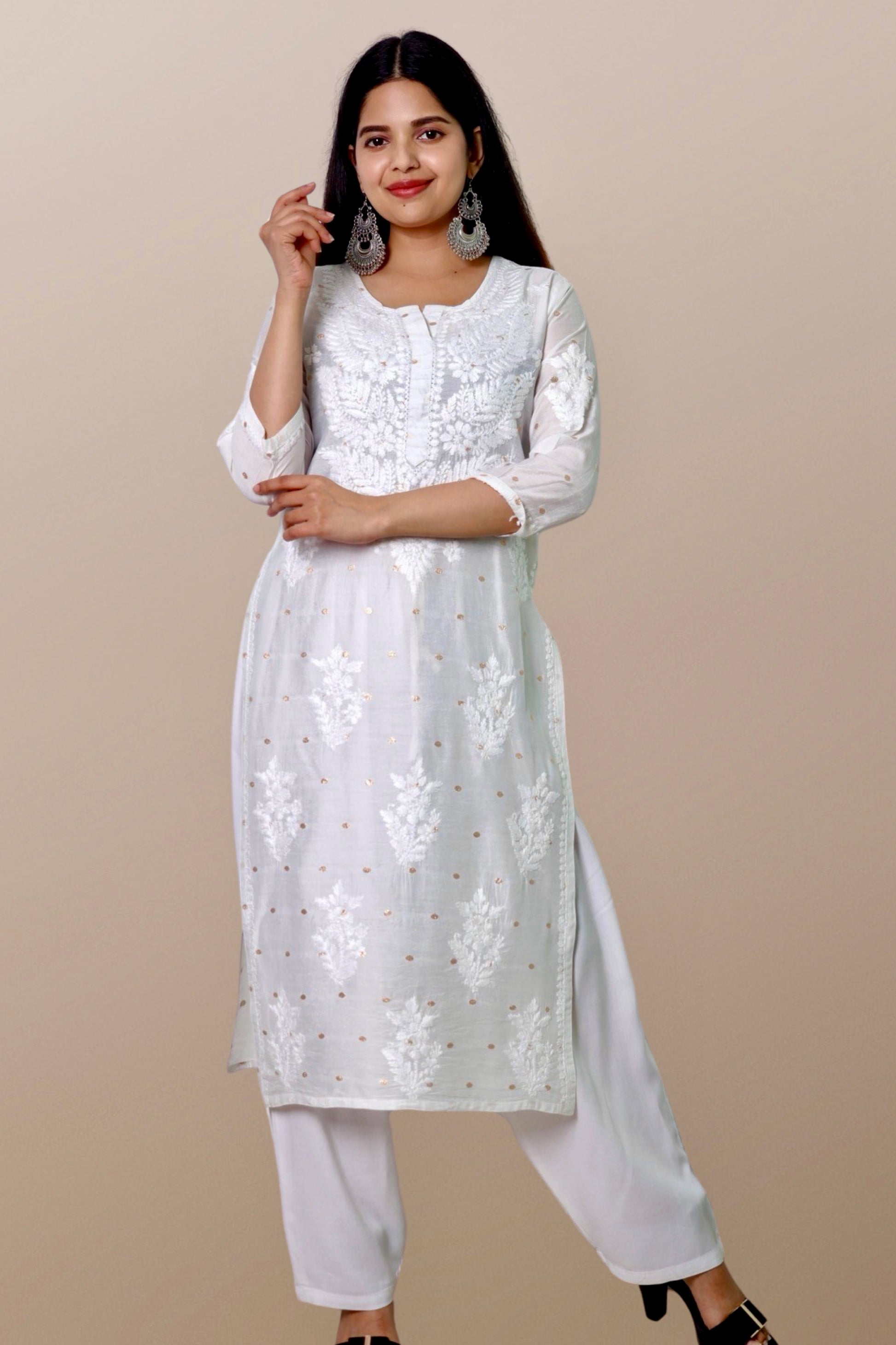 "Chikankari Kurta: A hand-embroidered Chanderi White kurta featuring intricate Chikankari craftsmanship, showcasing delicate floral and geometric patterns for a timeless and elegant look."