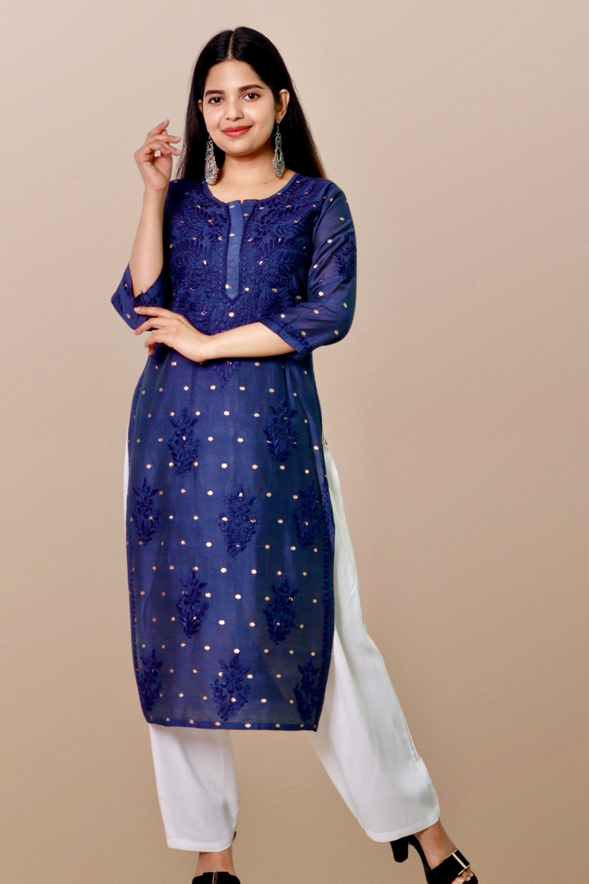 "Chikankari Kurta: A hand-embroidered Chanderi kurta featuring intricate Chikankari craftsmanship, showcasing delicate floral and geometric patterns for a timeless and elegant look."