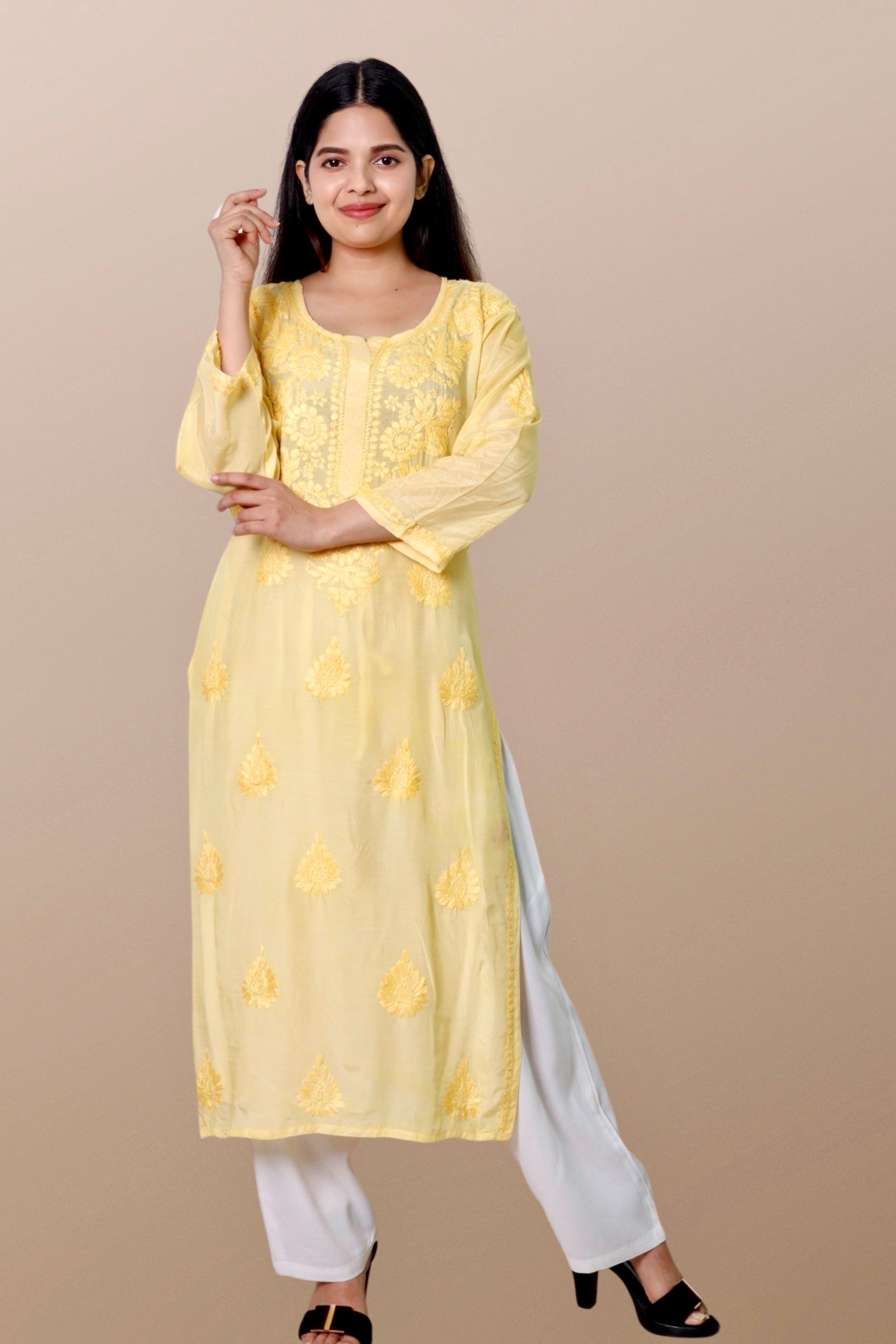 "Chikankari Kurta: A hand-embroidered Chanderi kurta featuring intricate Chikankari craftsmanship, showcasing delicate floral and geometric patterns for a timeless and elegant look."