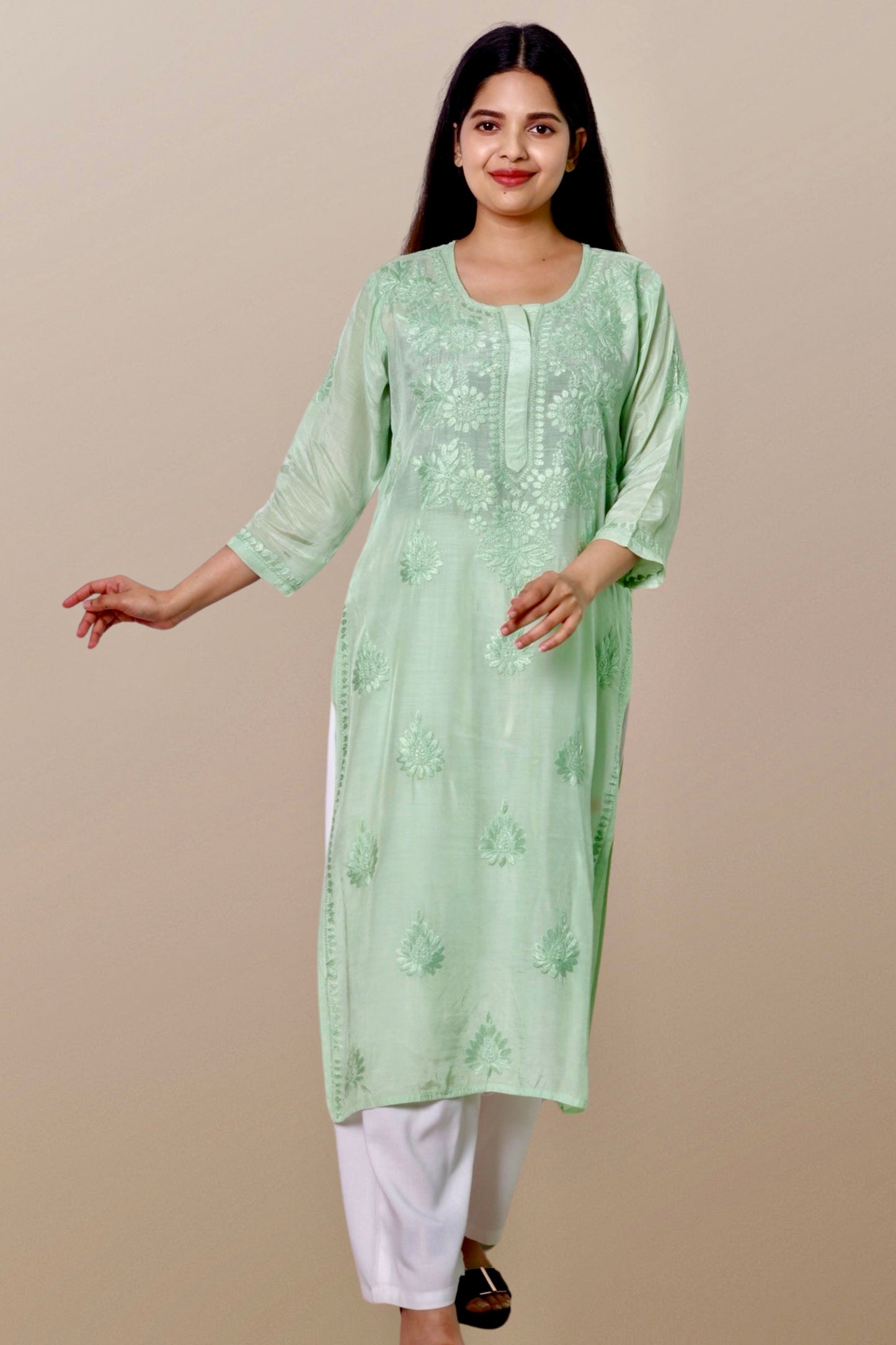 "Chikankari Kurta: A hand-embroidered Chanderi kurta featuring intricate Chikankari craftsmanship, showcasing delicate floral and geometric patterns for a timeless and elegant look."